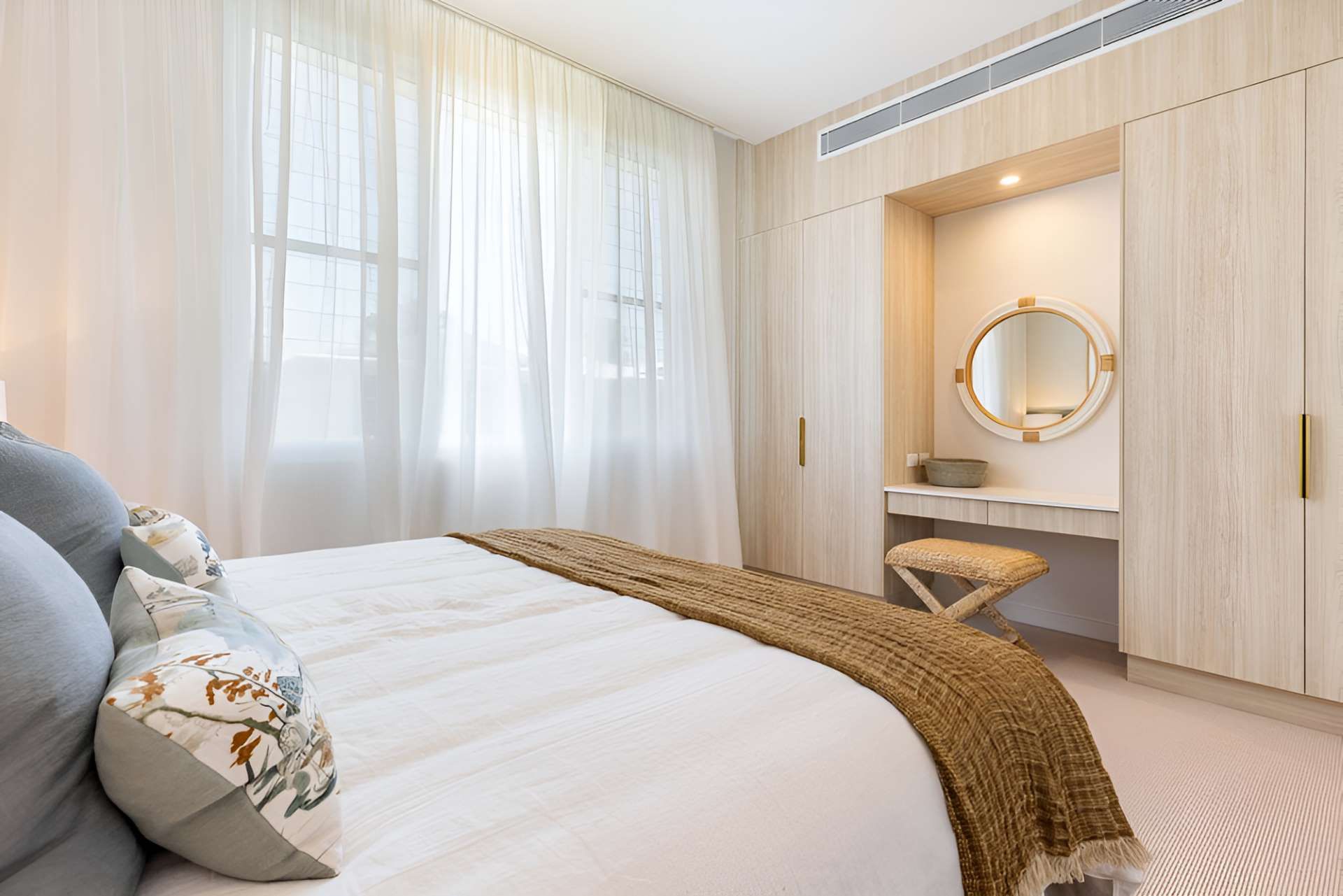 A Bedroom With a Bed, Dresser and Mirror — Kitchens by CCJS in Bungalow, QLD