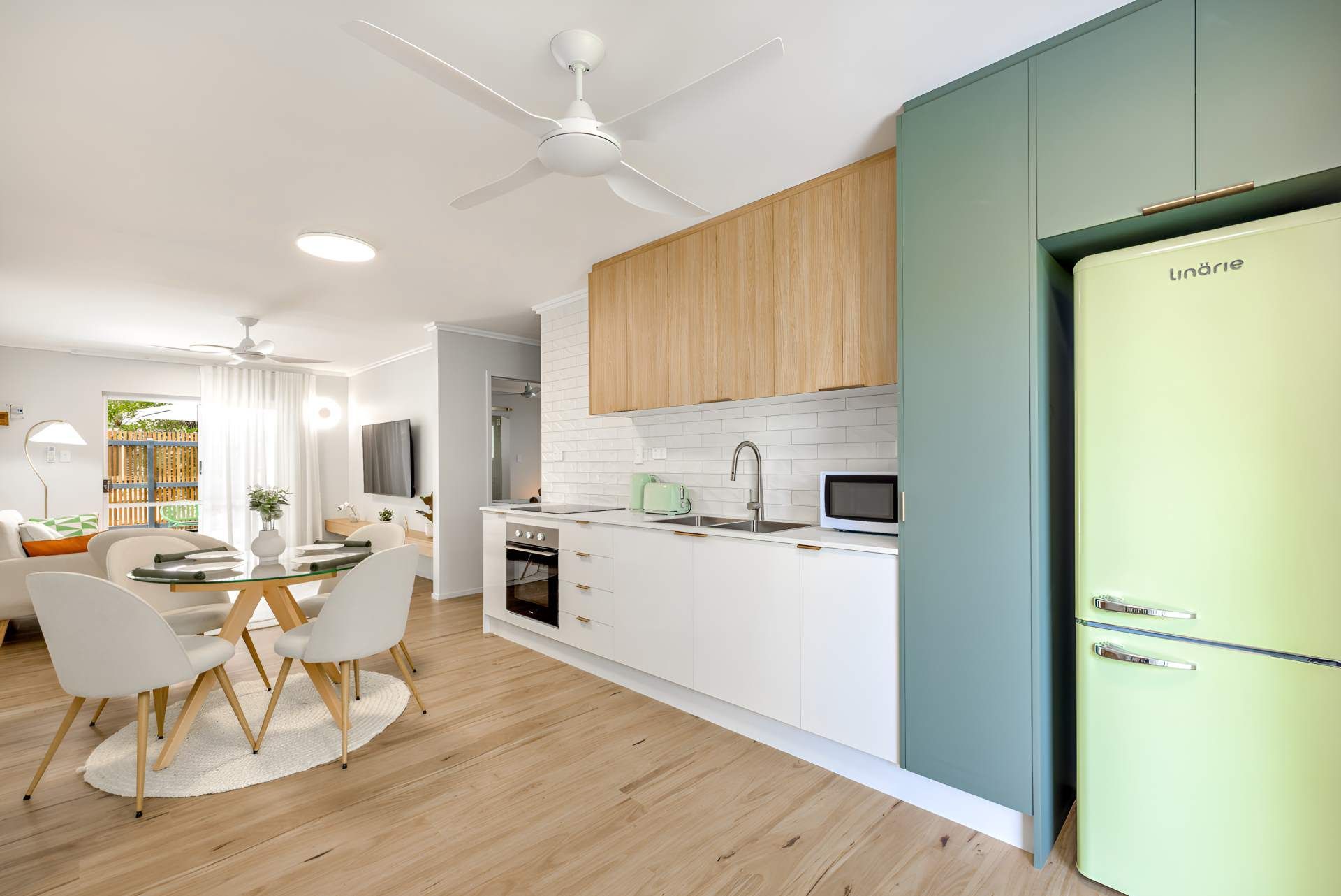 A Kitchen With a Green Refrigerator and a Ceiling Fan — Kitchens by CCJS in Bungalow, QLD