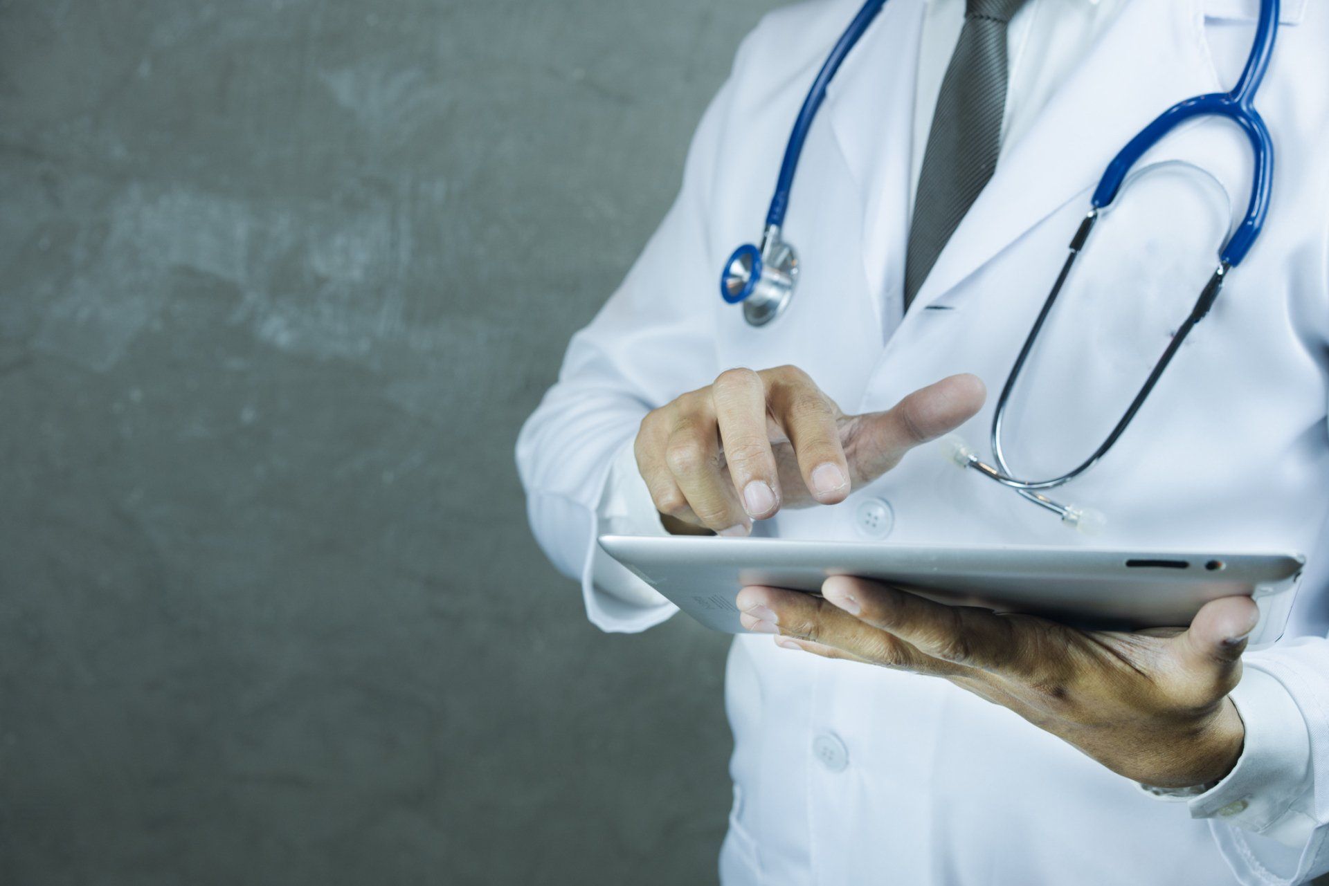 Doctor Holding Tablet — SE Decatur, AL — Alabama Urology and Robotic Center