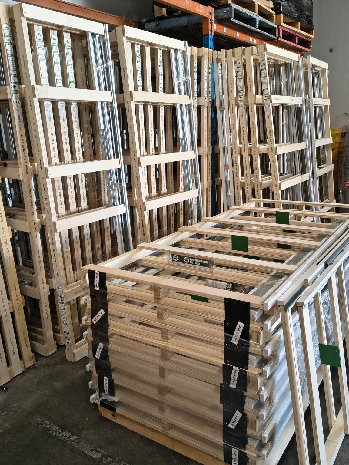 Man Browsing Wood Trim in a Hardware Store โ Kev's Group QLD in Kawana, QLD