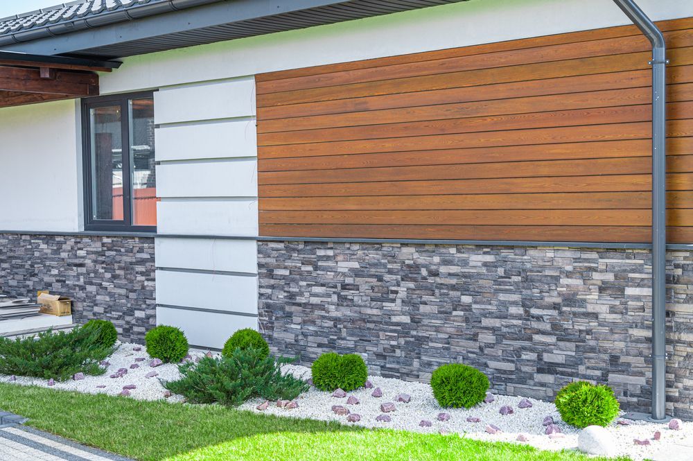 Exterior of a House With Stone, Wood, and White Panels โ Kev's Group QLD in Kawana, QLD