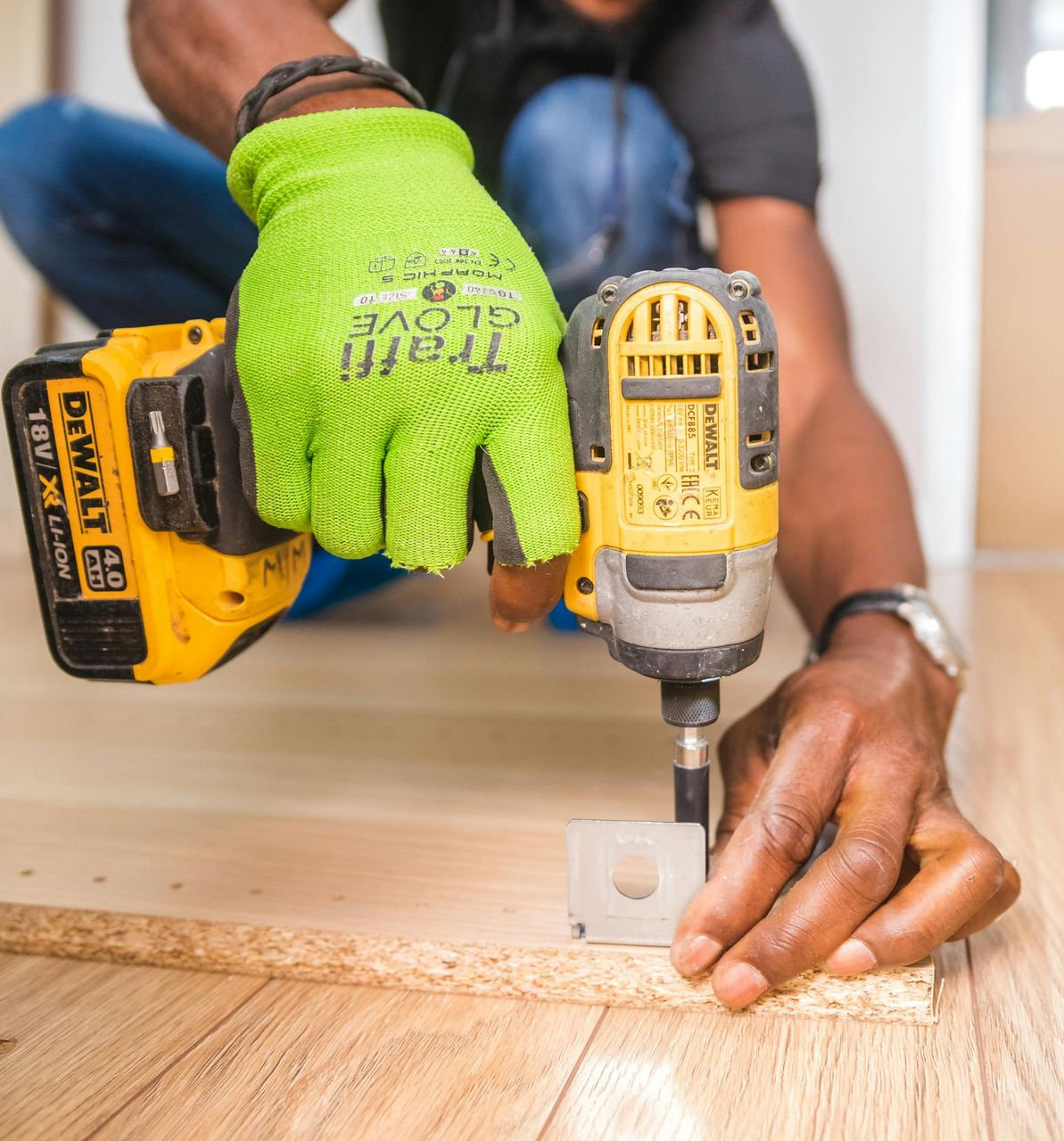 Yellow and Black Bostitch Pneumatic Nail Gun on a Wooden Surface — Kev's Group QLD in Kawana, QLD