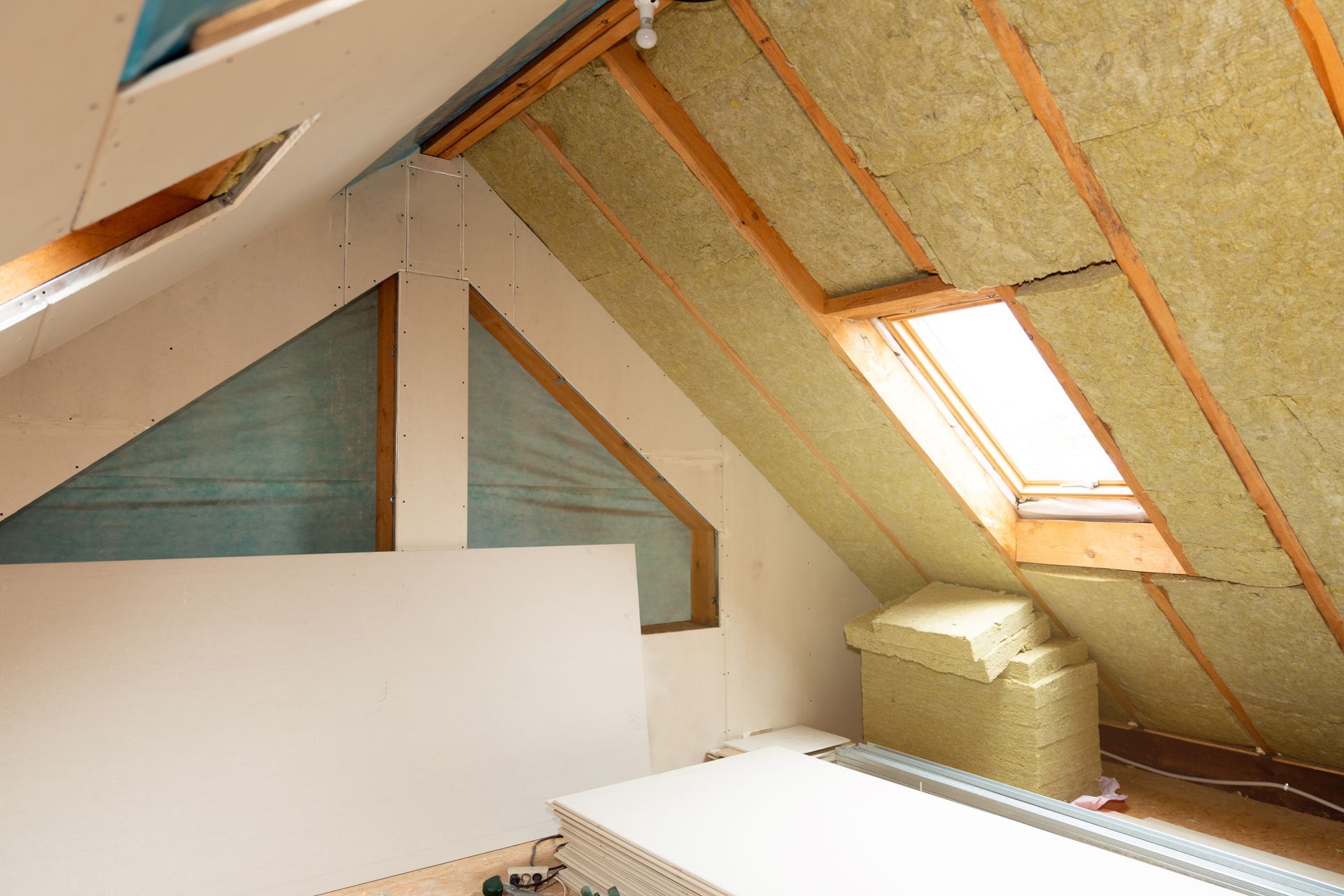 Interior Attic With Insulation Installed Between Rafters — Kev's Group QLD in Kawana, QLD