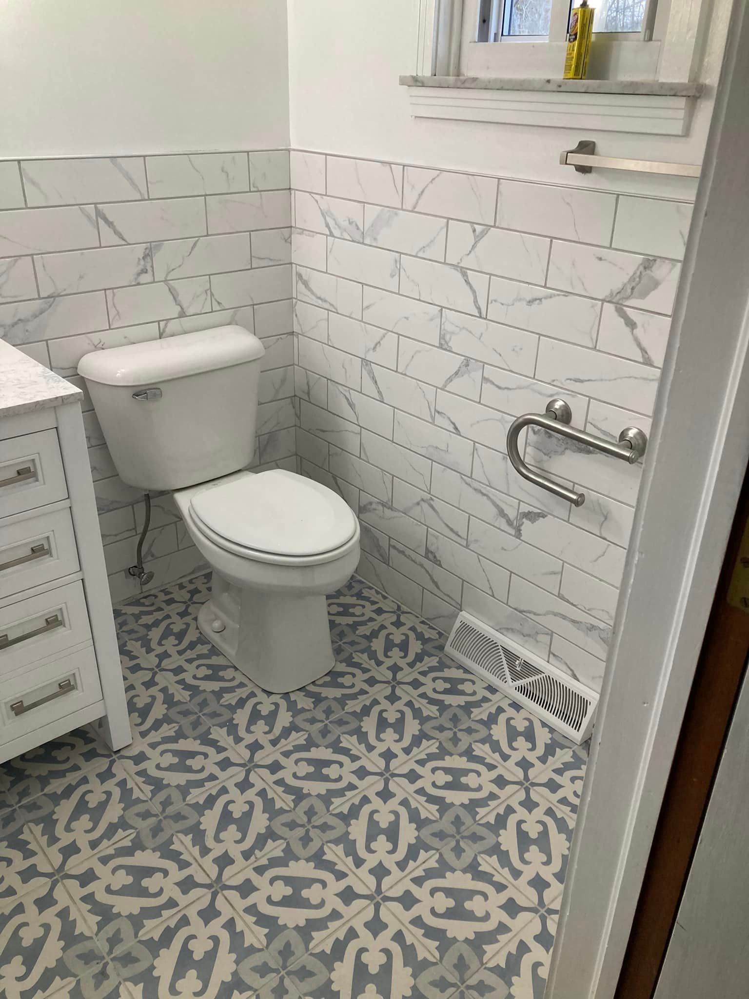 A new white bathroom with a toilet, sink