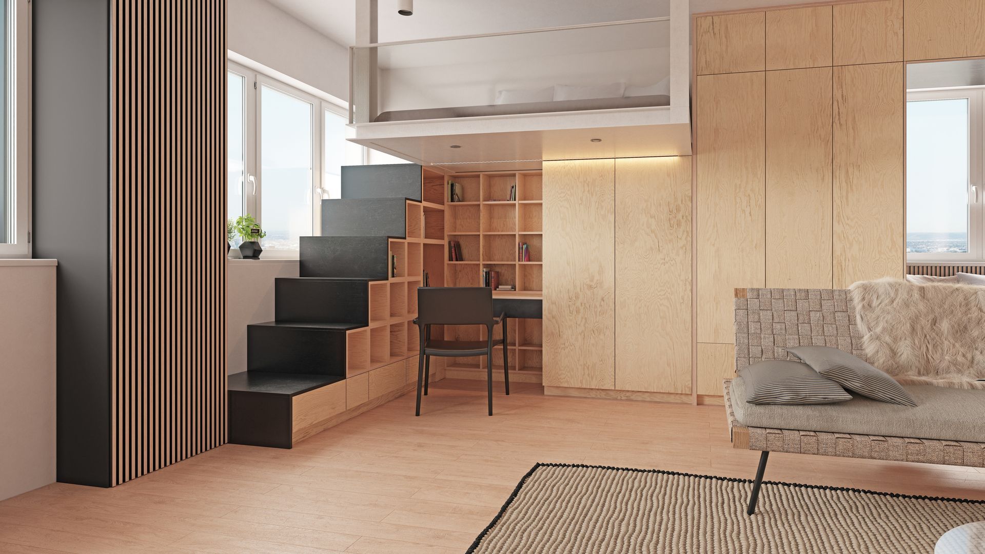 A living room with a couch , desk , stairs and a bunk bed.