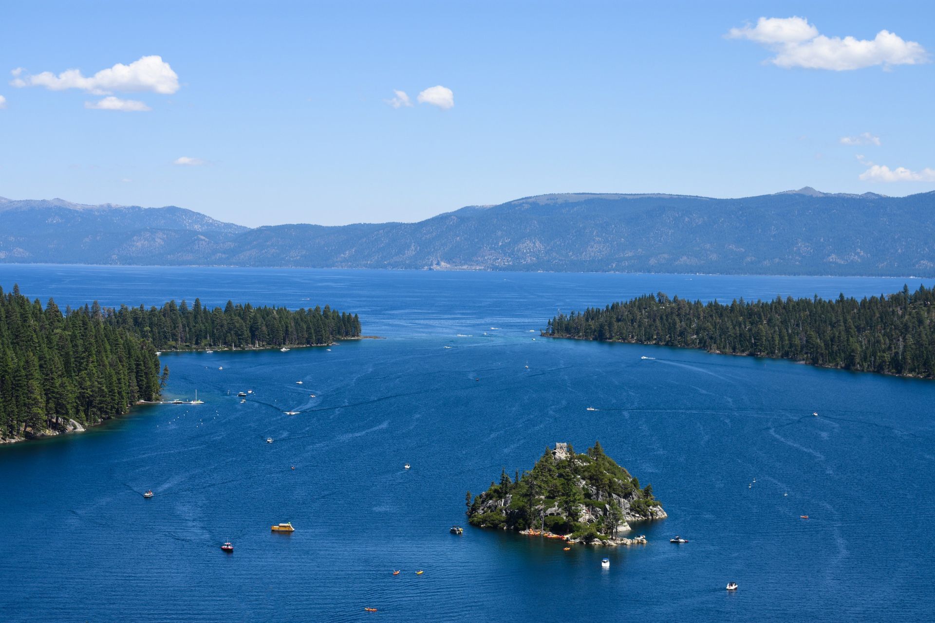 A large body of water with a small island in the middle.