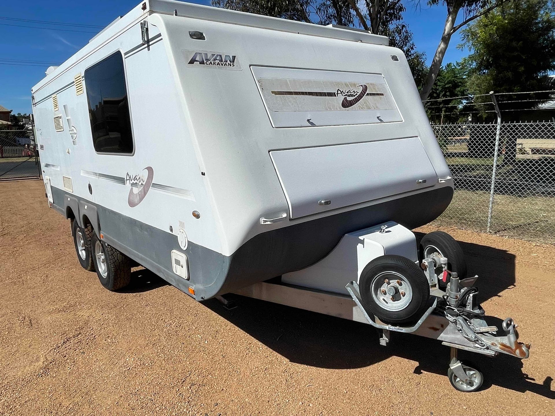 White Travel Trailer Parked on Gravel — B & C Caravan Service Pty Ltd In Dubbo, NSW