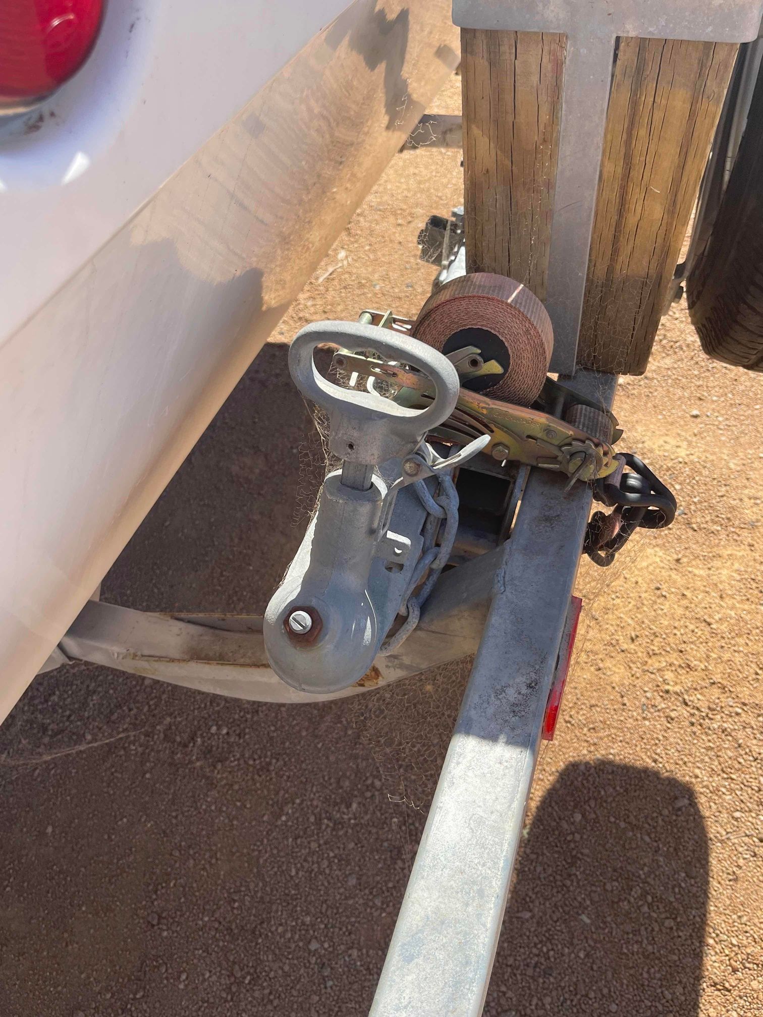 Boat Trailer Winch and Hitch Beside a White Boat — B & C Caravan Service Pty Ltd In Dubbo, NSW