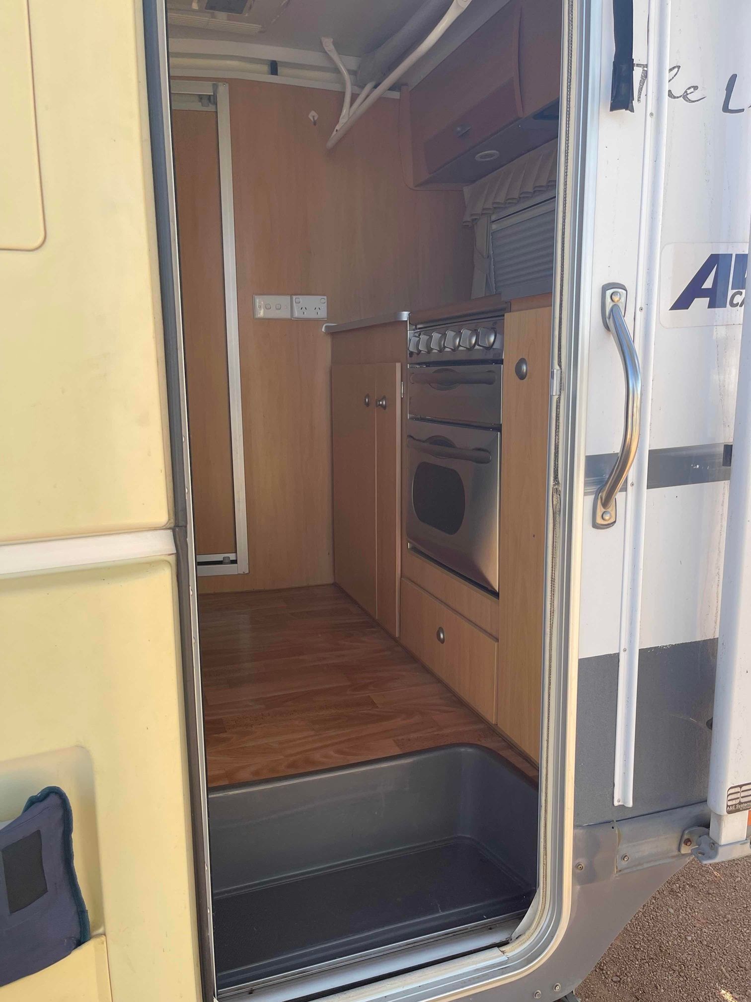 Open Rv Doorway Showing Wood-finish Interior — B & C Caravan Service Pty Ltd In Dubbo, NSW