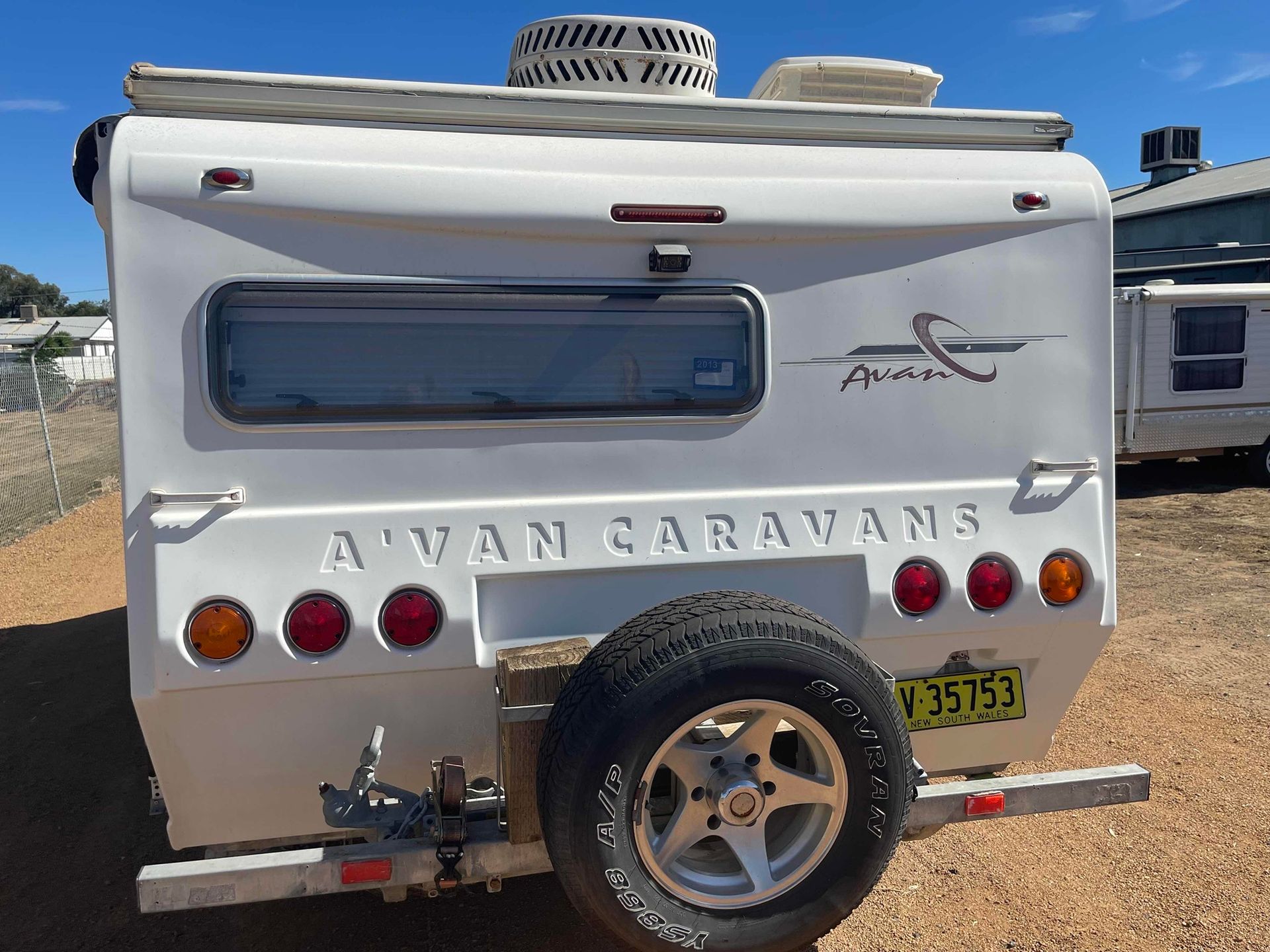 Rear View of a White Avan Caravan Parked Outdoors — B & C Caravan Service Pty Ltd In Dubbo, NSW