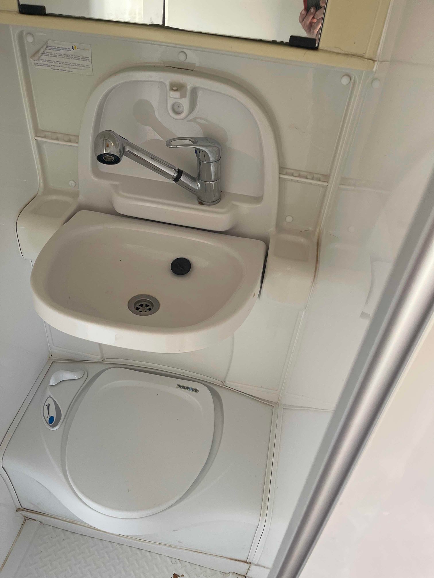 Compact White Wall-mounted Sink and Toilet — B & C Caravan Service Pty Ltd In Dubbo, NSW