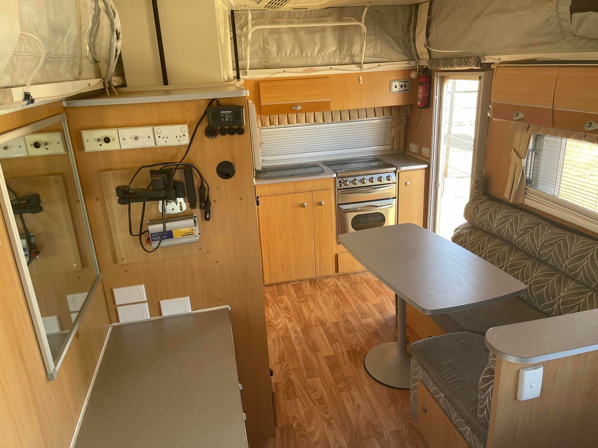 Compact Rv Interior With Wood Cabinets, Small Kitchen — B & C Caravan Service Pty Ltd In Dubbo, NSW
