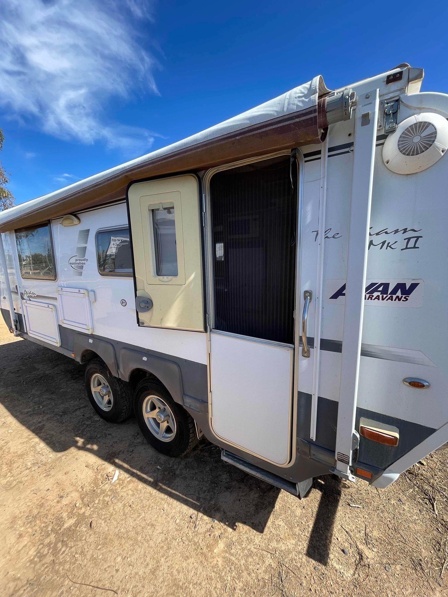 White Cargo Trailer With Open Side Door and Awning Parked — B & C Caravan Service Pty Ltd In Dubbo, NSW