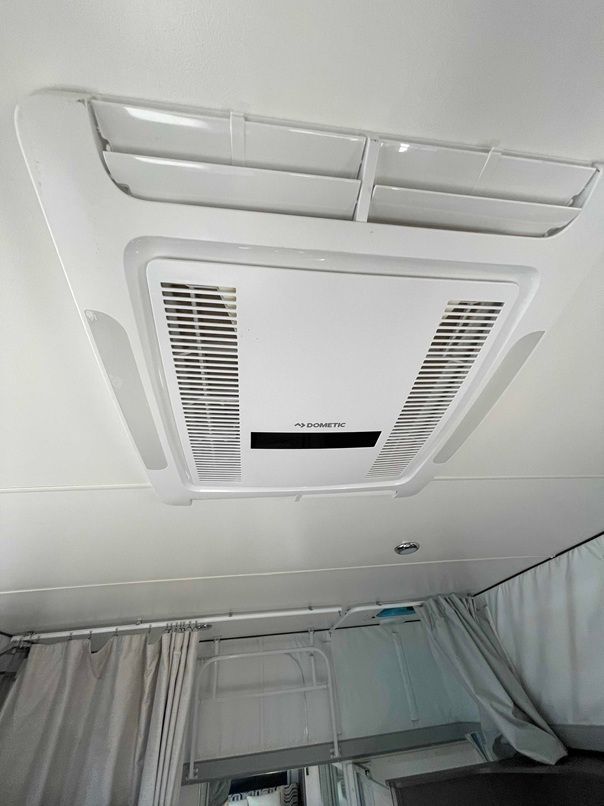 Ceiling-mounted Air Conditioner Vent Above a Bed — B & C Caravan Service Pty Ltd In Dubbo, NSW