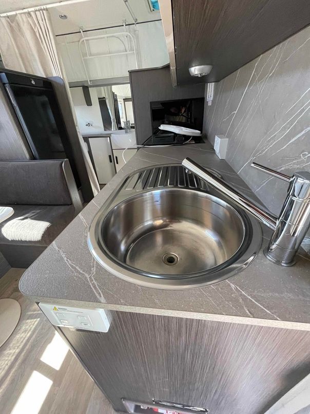 Compact Kitchen Sink With Chrome Faucet and Countertop — B & C Caravan Service Pty Ltd In Dubbo, NSW