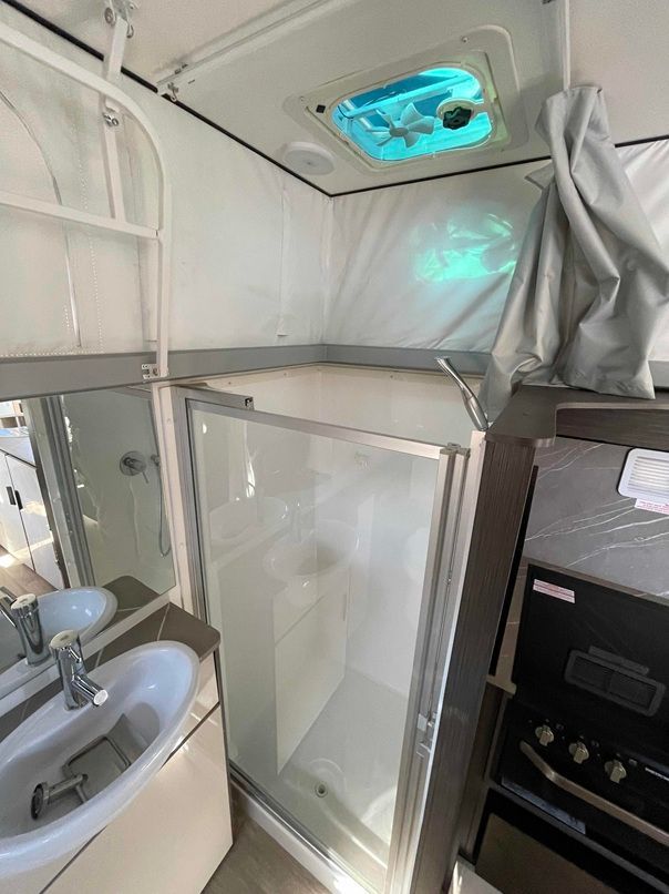 Compact Bathroom With White Walls, Sink, Shower — B & C Caravan Service Pty Ltd In Dubbo, NSW