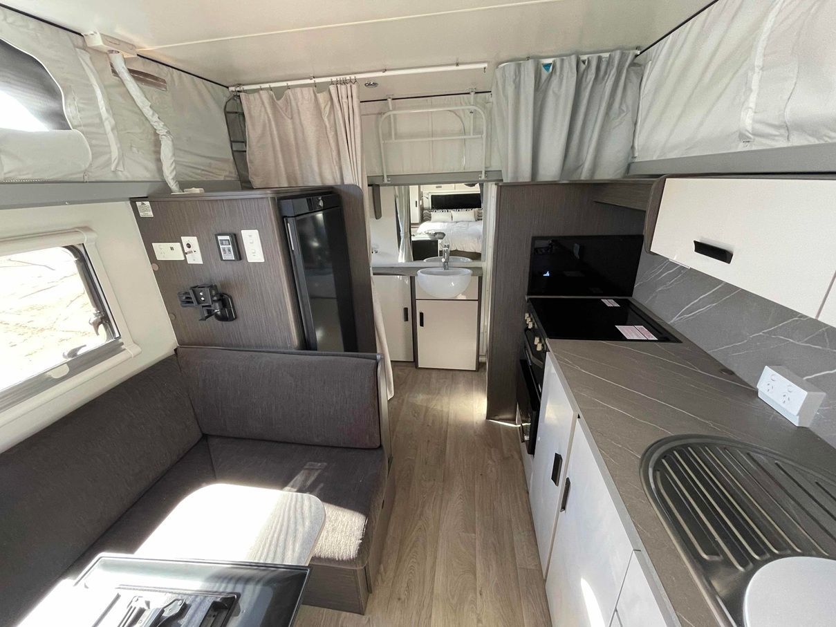 Compact Rv Interior With Gray Seating — B & C Caravan Service Pty Ltd In Dubbo, NSW