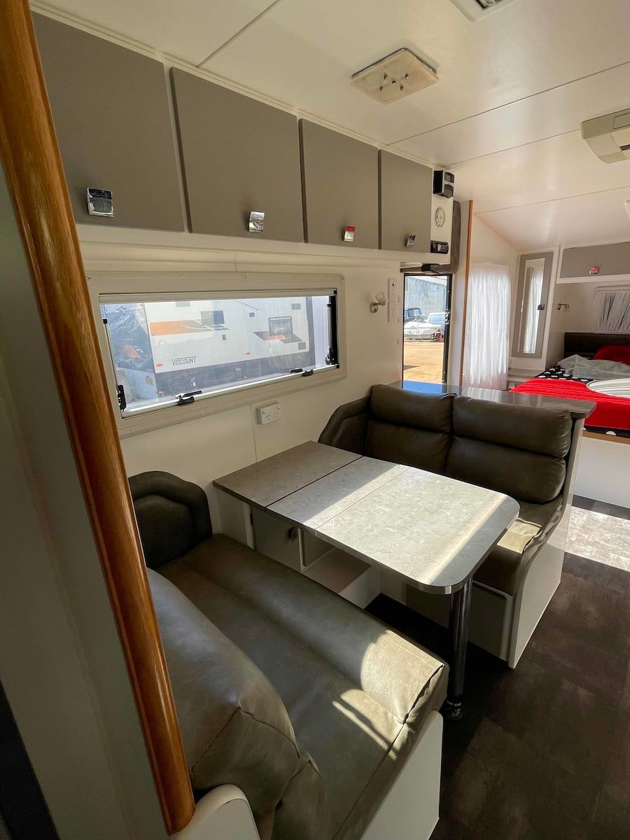 Compact Rv Dining Nook With Gray Bench Seating — B & C Caravan Service Pty Ltd In Dubbo, NSW