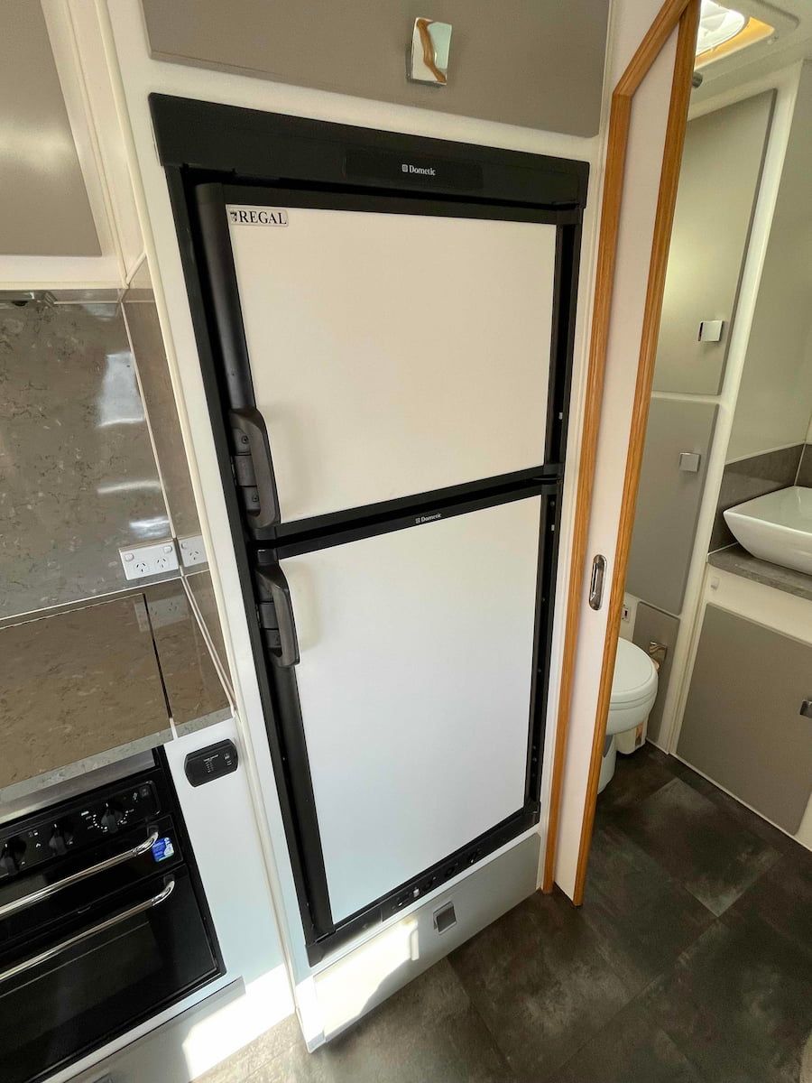Black-framed Refrigerator Door in a Narrow Kitchen or Rv — B & C Caravan Service Pty Ltd In Dubbo, NSW