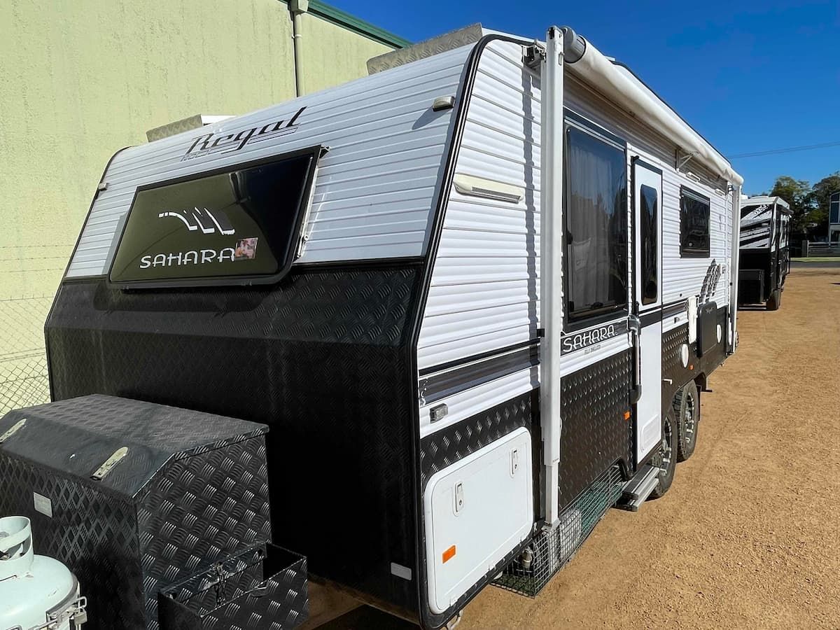 White and Black Travel Trailer With Diamond-plate Front Parked — B & C Caravan Service Pty Ltd In Dubbo, NSW