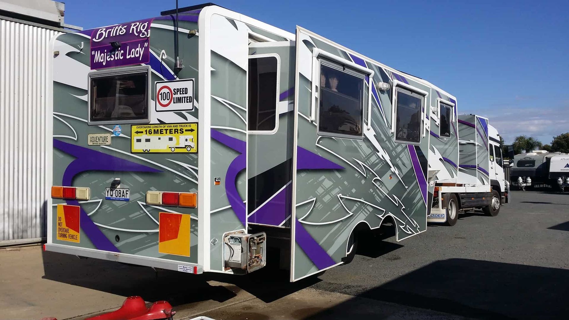 A Purple and White Bus With the Number 32 on It — B & C Caravan Service Pty Ltd In Dubbo, NSW