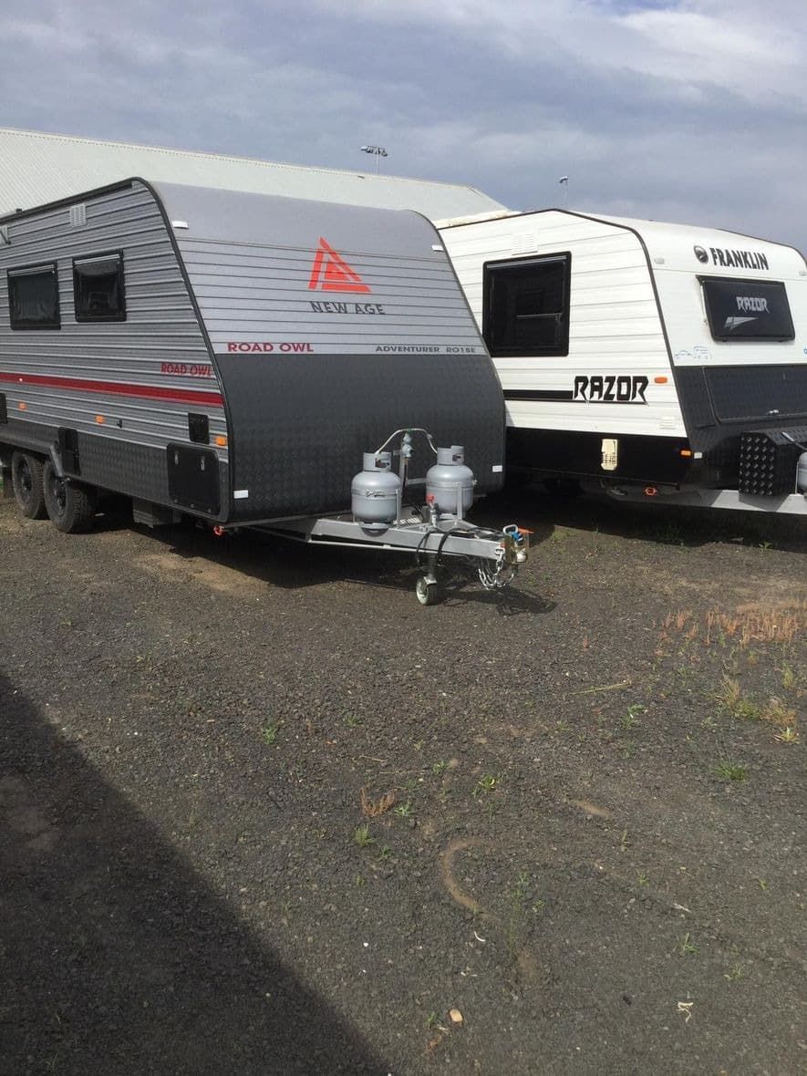 Two Caravans Are Parked Next to Each Other in a Parking Lot — B & C Caravan Service Pty Ltd In Dubbo, NSW