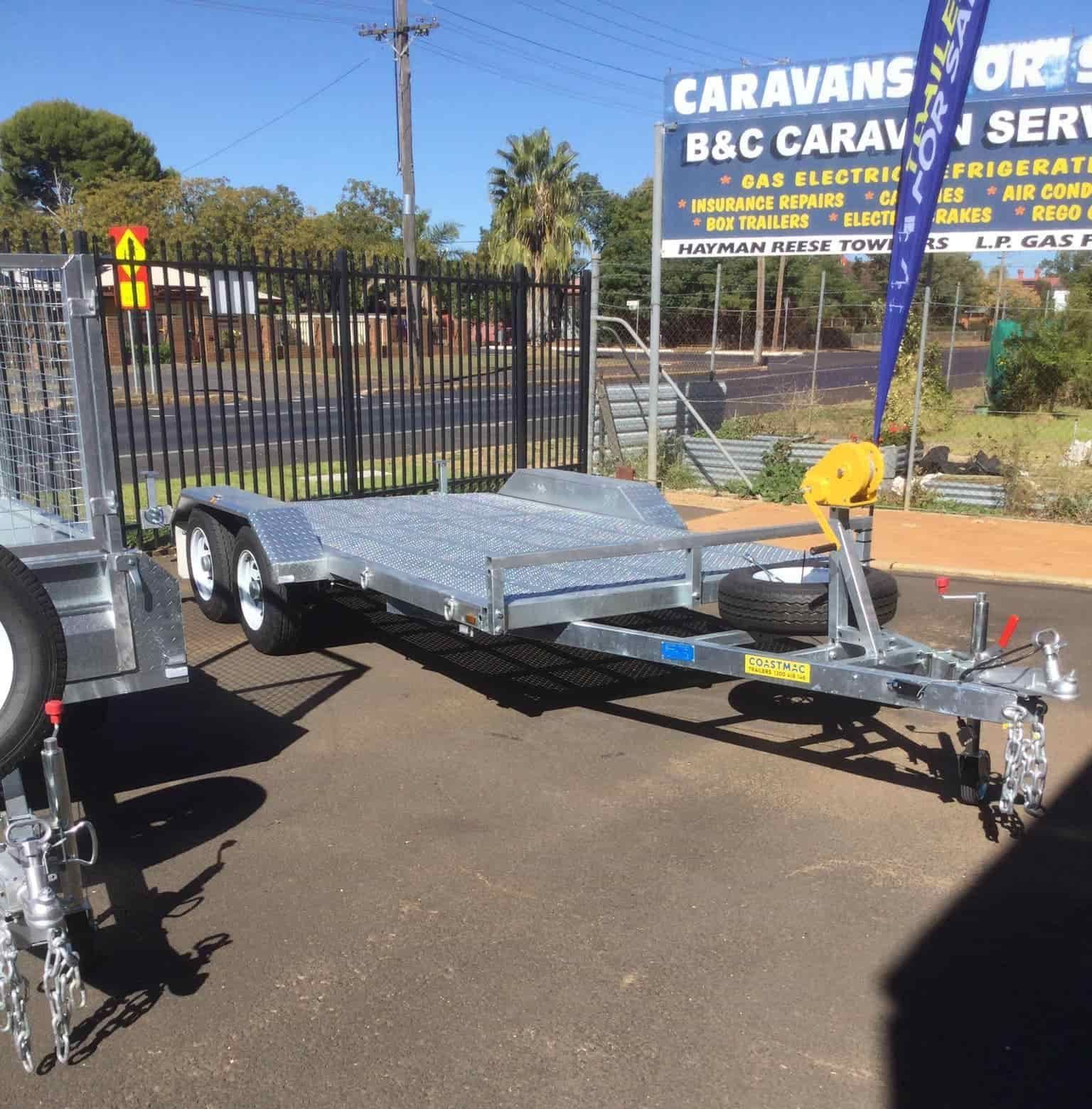 A Trailer is Parked in Front of a Sign That Says Caravans B & C Caravan Service — B & C Caravan Service Pty Ltd In Dubbo, NSW