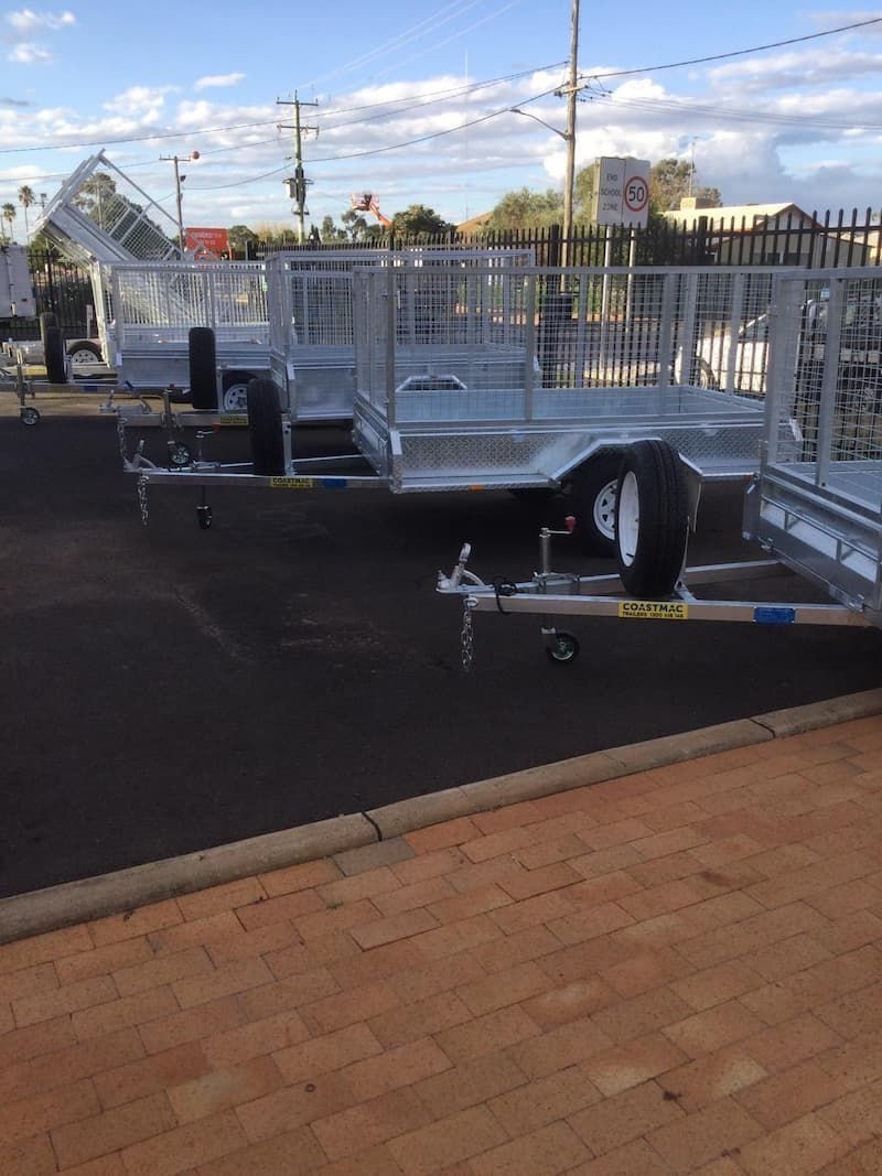 A Row of Trailers Are Parked on the Side of the Road — B & C Caravan Service Pty Ltd In Dubbo, NSW