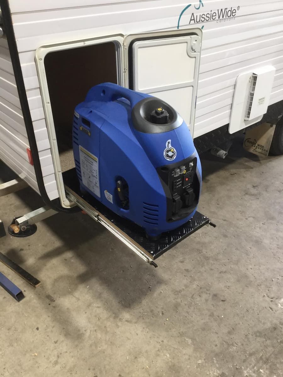 A Blue Generator is Attached to the Side of a Trailer — B & C Caravan Service Pty Ltd In Dubbo, NSW