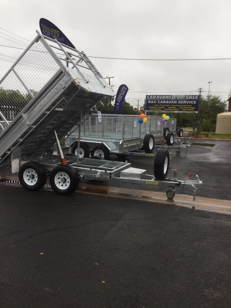 A Trailer is Parked on the Side of the Road in a Parking Lot — B & C Caravan Service Pty Ltd In Dubbo, NSW