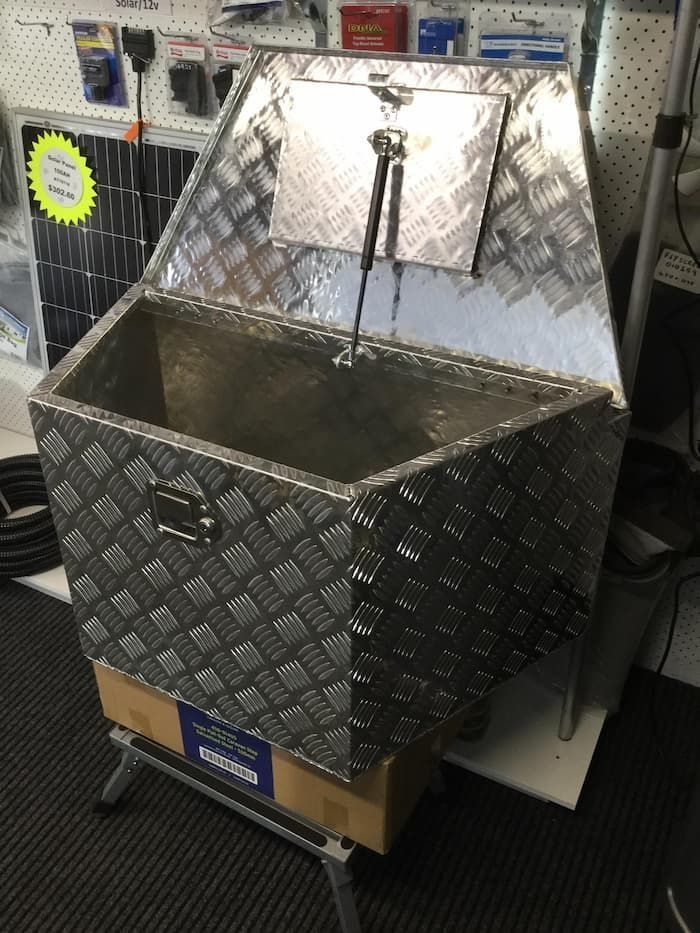 A Large Aluminum Box With the Lid Open is Sitting on a Table in a Store — B & C Caravan Service Pty Ltd In Dubbo, NSW