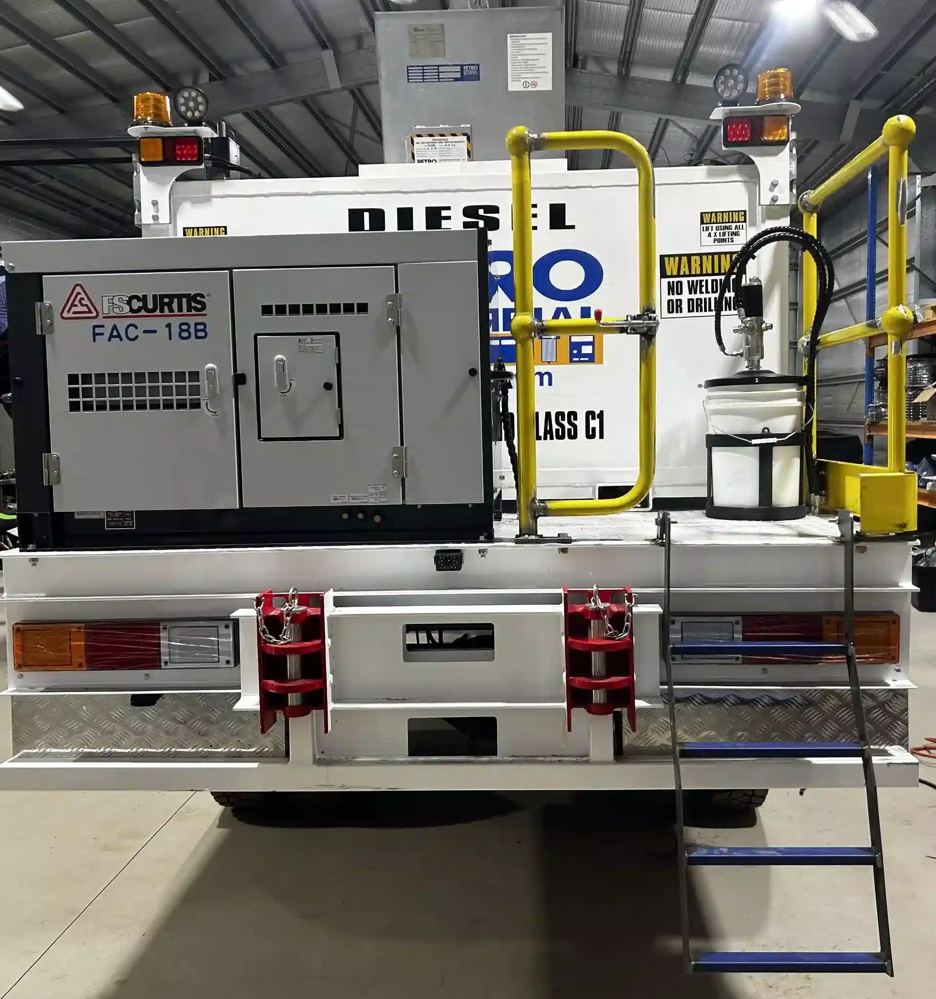 Mining specification service truck with fabricated hand rails and diesel generator attached in Yatala