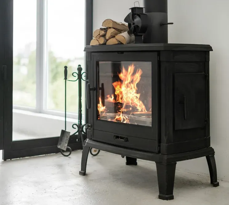 Wood-burning Stove on A Concrete Floor next to a Window — Southern Trade Services in Launceston, TAS 