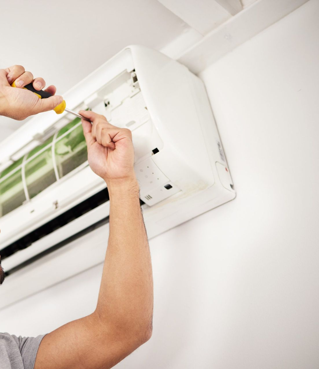 Technician Uses a Yellow Screwdriver — Southern Trade Services in Warburton, VIC