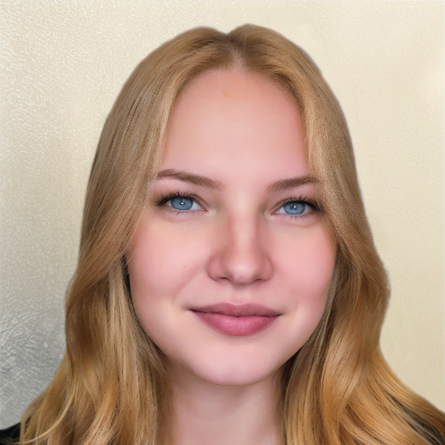 A woman with blonde hair and blue eyes is wearing a black shirt