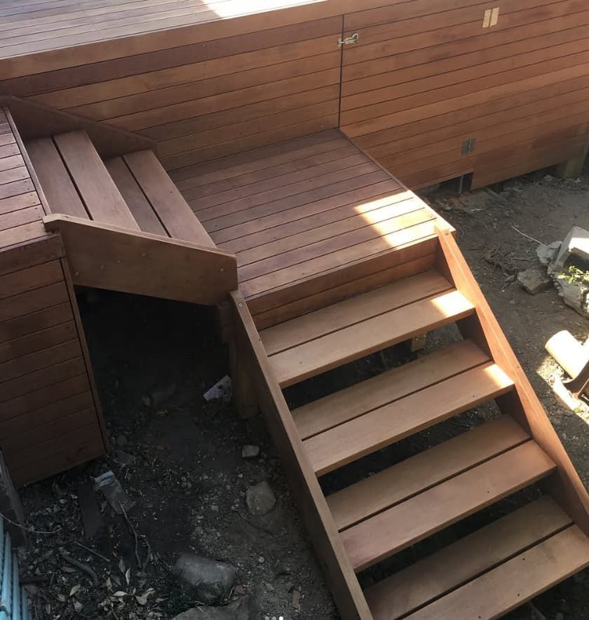 A Set Of Wooden Stairs Leading Up To A Wooden Deck — Penman Projects In Anna Bay, NSW