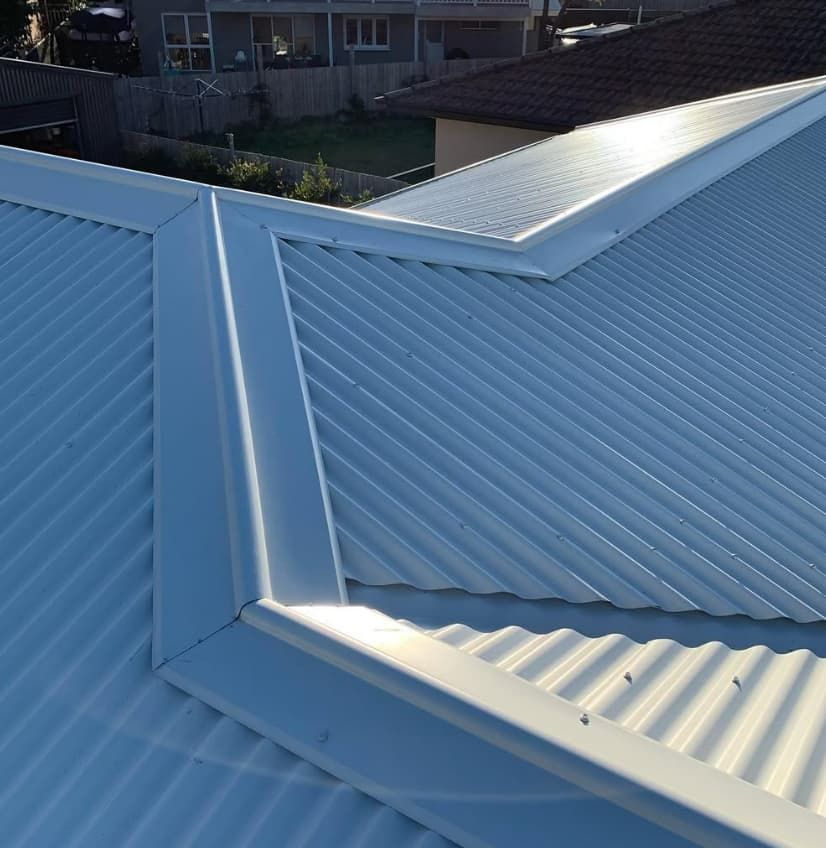 A White Roof With A Brown Roof In The Background — Penman Projects In Nelson Bay, NSW