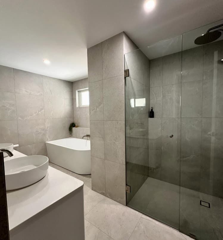 A Bathroom With A Bathtub , Sink , And Shower — Penman Projects In Salamander Bay, NSW