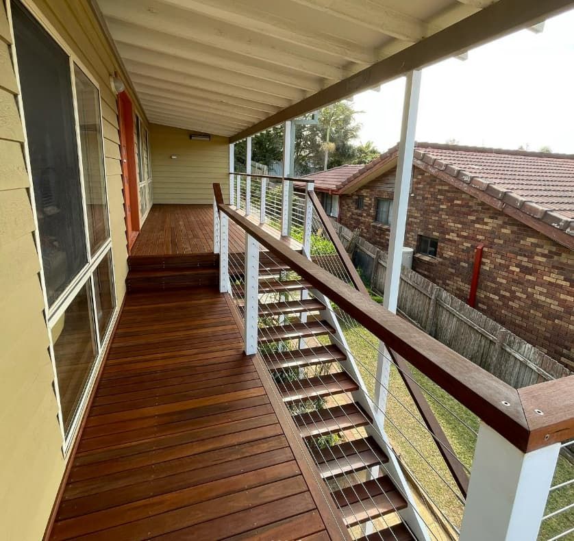 A Wooden Deck With Stairs Leading Up To It — Penman Projects In Nelson Bay, NSW