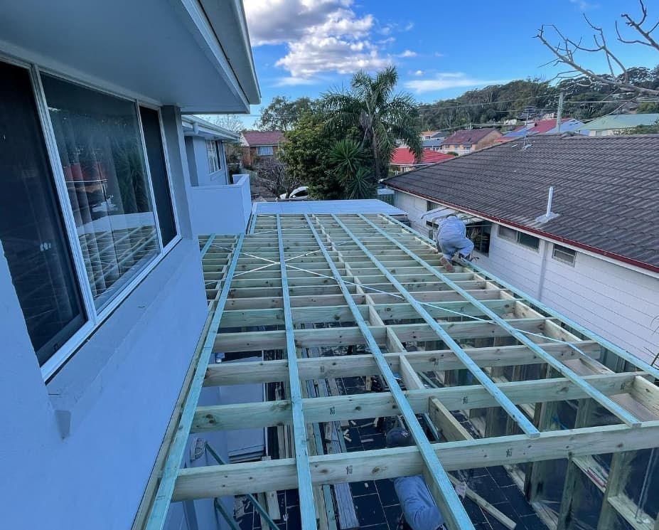 A Wooden Deck Is Being Built On The Roof Of A House — Penman Projects In Anna Bay, NSW