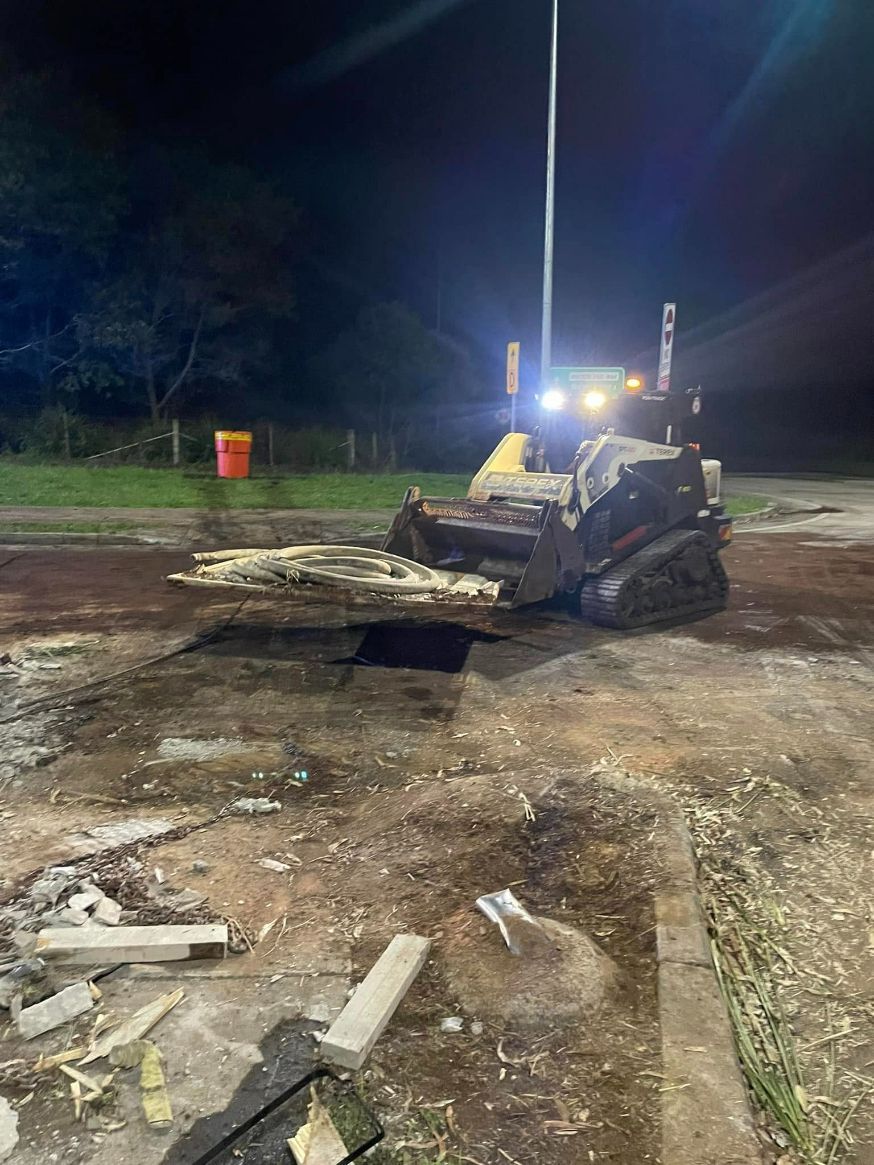 A Bulldozer is Working on a Construction Site at Night — Tallow Tree Services Pty Ltd in Lennox Head, NSW