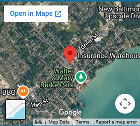 Google Maps satellite view with a red pin representing Insurance Warehouse in New Baltimore, MI.
