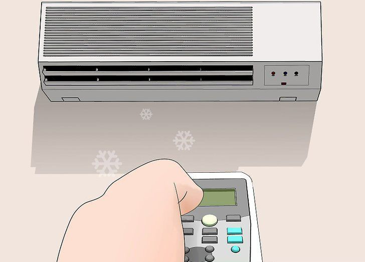 Hand holding a remote aimed at a wall-mounted air conditioner with snowflakes indicating cooling.