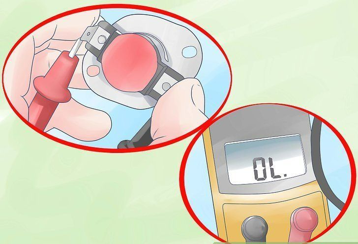Hands loading blood into a glucose meter, display reading