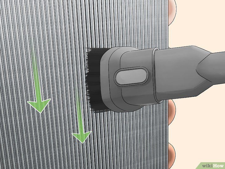 Black electric razor shaving gray hair, with green arrows showing the direction of strokes