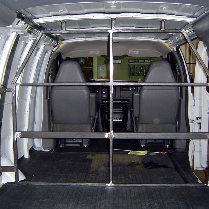 The Inside of a Van With a Metal Railing Between the Seats - Trucks Unique