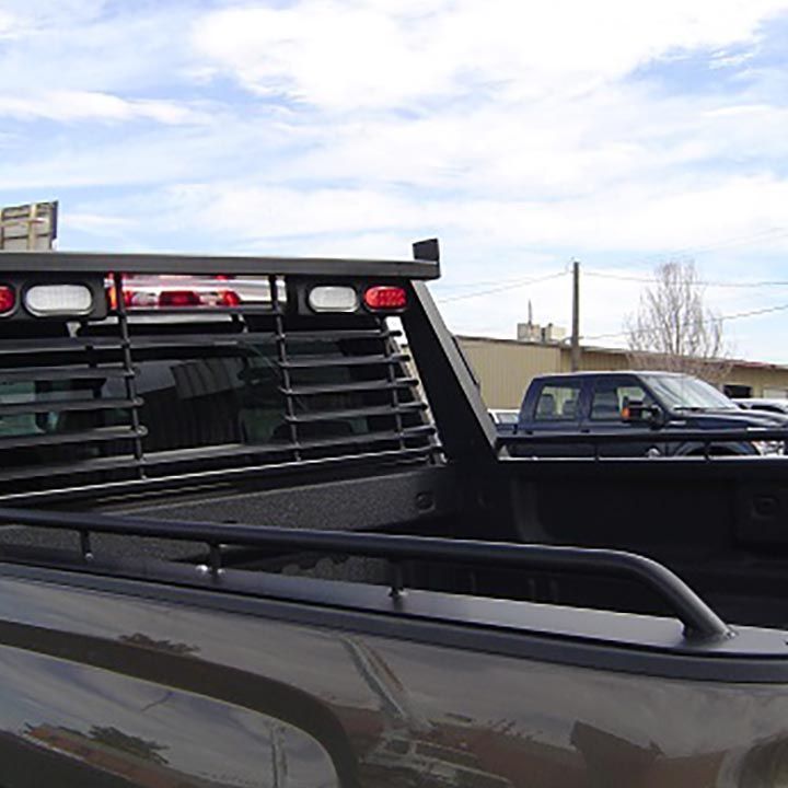Two Trucks are Parked Next to Each Other in a Parking Lot - Trucks Unique