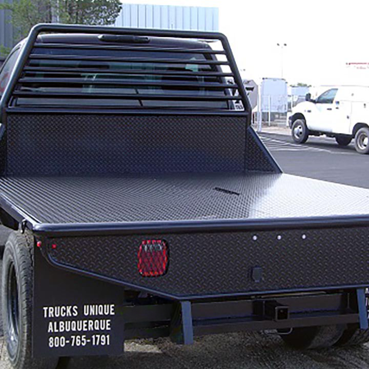 A Black Truck Parked on a Parking -Trucks Unique