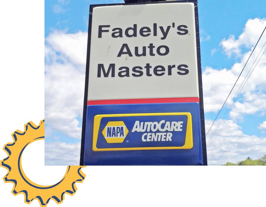 Fadely’s Auto Masters roadside sign with NAPA AutoCare Center branding.