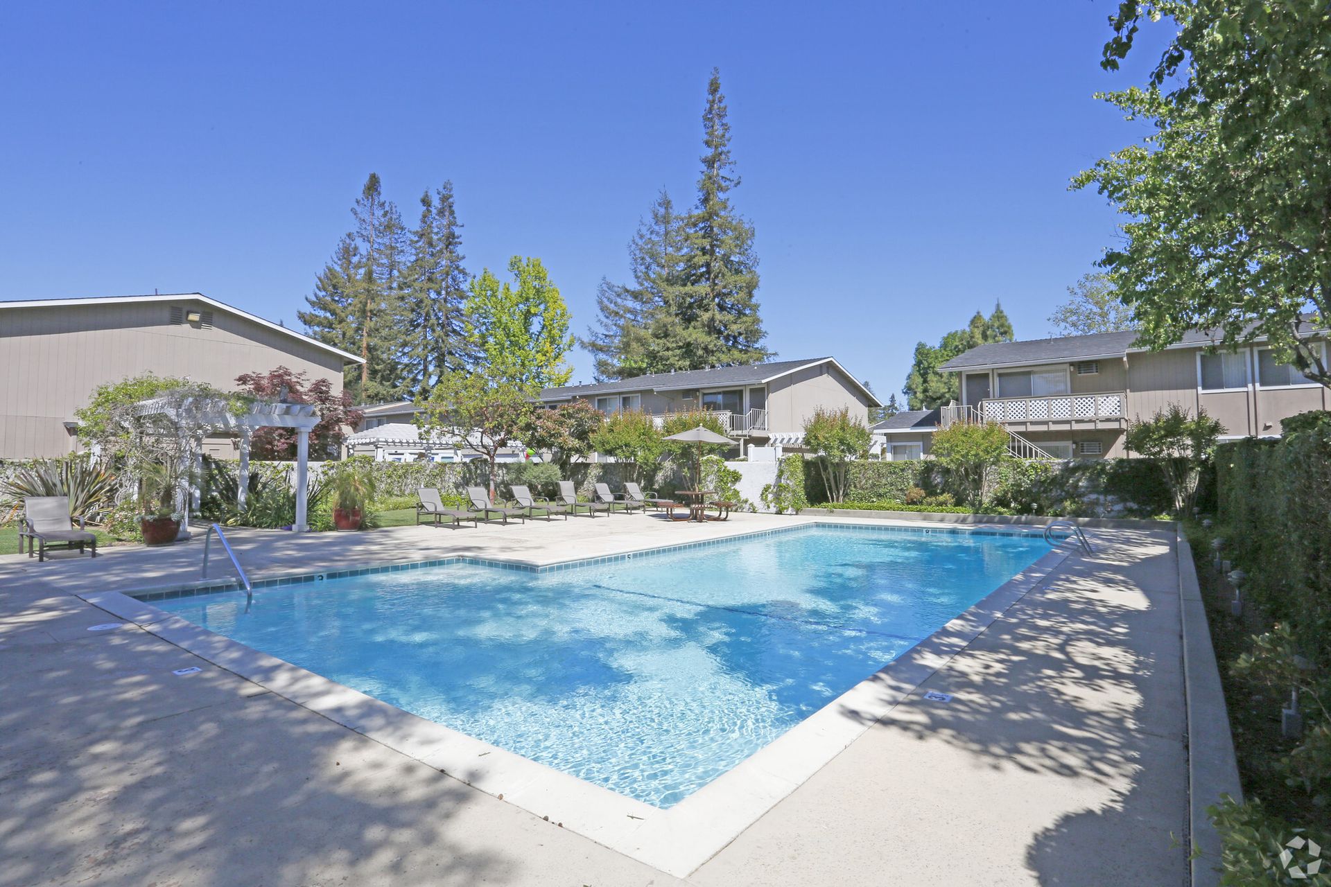 A large swimming pool in front of a building